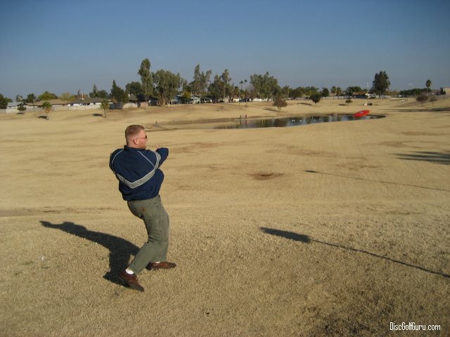 Ben drives a disc towards hole #2 at Emerald Park in Mesa