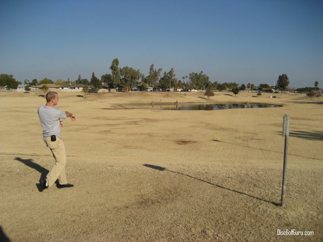 Blake drives a disc towards hole #2 at Emerald Park in Mesa